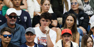 Lleyton (front row,second from left) and Bec Hewitt (middle third from left) support their son Cruz on Sunday,along with coach Peter Luczak (front left) and Jaymon Crabb (back left).