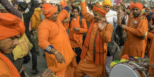 Devotees celebrate the day before the inauguration of the Ram temple in Ayodhya,India.