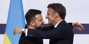 French President Emmanuel Macron hugs Ukrainian President Volodymyr Zelenskyy in Paris.