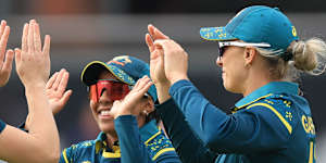 Australia’s Ashleigh Gardner,right,celebrates with teammates Alana King and Annabel Sutherland,left,after taking the wicket of South Africa’s Nonkululeko Mlaba to win the game during the Women’s T20 World Cup match between Australia and South Africa at Old Trafford,Manchester,England,Saturday June 13,2026. (Nigel French/PA via AP)