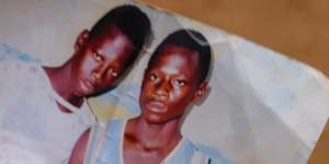 Gban villager Kwame Teng pictured with his brother who died inside the mine.