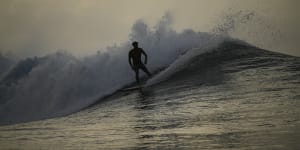 Tahitian-born surfer Kauli Vaast rides a wave in Teahupo’o,Tahiti,French Polynesia.