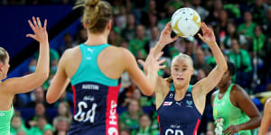 Vixens player Jo Weston passes the ball during the Super Netball Grand Final match against West Coast Fever and Melbourne earlier this month.