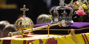 The orb,the sceptre and the crown atop the royal coffin as it leaves Westminster Abbey.