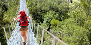 The Bowtell Swing Bridge,a narrow,precarious-looking suspension bridge built in 1991 by the 1st Field Squadron of the Royal Australian Engineers..