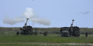 Philippine troops fire shots during the Balikatan military exercises on Wednesday.