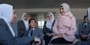 Students at Al-Faisal College in Auburn with principal Safia Khan Hassanein. The school is ranked 15th on the Herald’s rankings this year.