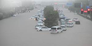 Vehicles are stranded in floodwater near Zhengzhou railway station,China,2021. 