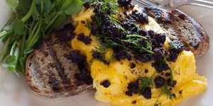 Scrambled eggs with black pudding and watercress.