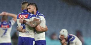 Bronson Xerri and Jacob Kiraz hug after the Bulldogs victory over the Roosters.