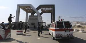 Palestinian ambulances arrive at the border crossing.