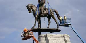 Crews remove one of America’s largest remaining monuments to the Confederacy,a towering statue of Confederate General Robert E. Lee in Richmond Virginia in 2021.