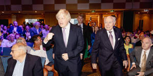Boris Johnson was introduced by former Australian prime minister Scott Morrison and later interviewed by former PM John Howard (right).