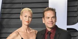 Sarah and Lachlan Murdoch pose at the Vanity Fair Oscars party in Hollywood.