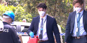 A detective leave Lewis Contintental Kitchen with a jerry can on Sunday afternoon. 