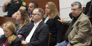 Tony Montalto,seated with his wife,Jennifer,reacts during the reading of jury instructions in the penalty phase of the trial of Marjory Stoneman Douglas High School shooter Nikolas Cruz.