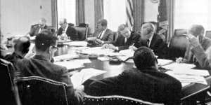 The Cuban missile crisis. John F. Kennedy meeting with advisers. Nuclear technology helped prevent a third world war in the 20th Century.