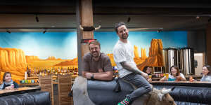 Moon Dog Wild West in Footscray,featuring the mechanical bull ridden by owners Josh Uljans (left) and Karl van Buuren.