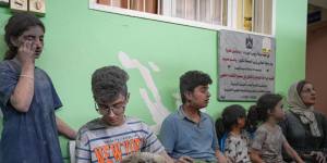 Injured civilians wait for treatment following Israeli airstrikes in the Rimal district of Gaza City.