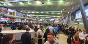 Passengers face long queues at Sydney Airport.