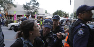 Twelve arrested as climate protesters take over Brisbane's city streets