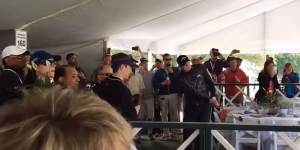 American golfer Jason Kokrak plays the ball from second floor of a hospitality tent at Wells Fargo