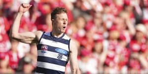 Mitch Duncan of the Cats celebrates after kicking a goal.