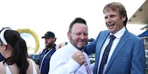 Darby Racing’s Scott Darby and trainer Bjorn Baker celebrate a win.