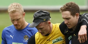 Noah Cumberland is helped off the training track at Richmond.