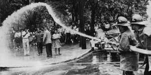 Firemen train high-powered hoses on protestors on May 3,1963.