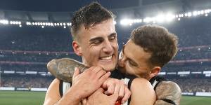 Elliott (right) with Nick Daicos after Collingwood’s preliminary final win.