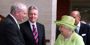 Queen Elizabeth II shaking hands with former IRA commander Martin McGuinness in 2012. By then McGuinness was Northern Ireland’s deputy first minister.