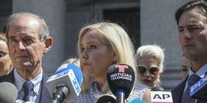 Virginia Roberts Giuffre,who says she was trafficked by Jeffrey Epstein,holds a news conference outside a Manhattan court with her lawyer in August,2019.