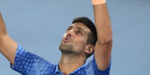 Novak Djokovic takes in his victory on Sunday night.