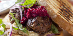 Meatball sandwich with hummus and beetroot.