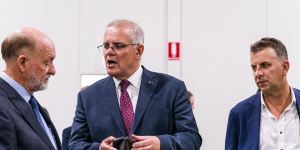 Prime Minister Scott Morrison speaks to Air Affairs Australia chief executive Chris Sievers about the trainees he has hired.