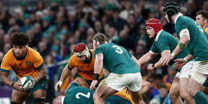 Australia’s Rob Valetini,left,runs with the ball against Ireland