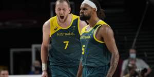 Roar emotion:Joe Ingles and Patty Mills are pumped up as success against Slovenia looms.