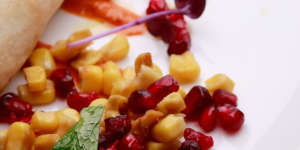 Breakfast burrito filled with cheesy white beans.