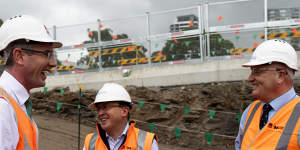 Sydney Metro chief executive Peter Regan,centre,at a metro rail site with Premier Dominic Perrottet,left,and Transport Minister David Elliott late last year.