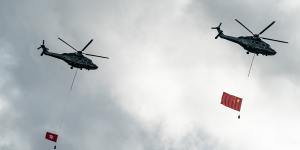 Helicopters fly the flags of China and Hong Kong over Victoria Harbour,HK,on July 1 - the first day of the new laws and the 23rd anniversary of the handover from British rule.
