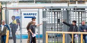 Former Ford workers leaving the Broadmeadows plant at the end of their last shift