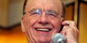 Rupert Murdoch smiles as he speaks at a press conference in Tokyo on November 6,2006. 