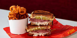 The menu is focused on sandwiches (Reuben pictured),curly fries,shakes and coffee.