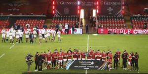 The Wales team celebrate after defeating England and winning the Triple Crown following the Six Nations rugby union match between Wales and England at the Millennium stadium in Cardiff,Wales,Saturday,Feb. 27,2021. Wales win the triple crown for defeating Ireland,Scotland and England. Wales defeated England 40-24. 