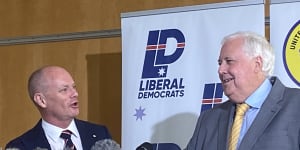 Enemies Campbell Newman and Clive Palmer turn mates for votes