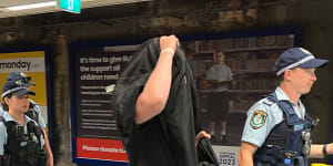 Police questioned men wearing black at North Sydney train station on Australia Day.