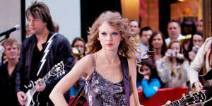 Taylor Swift in her Speak Now era,one of finding and losing love.