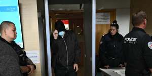 Dominique Pelicot’s co-accused pass security on arrival at the court in Avignon.