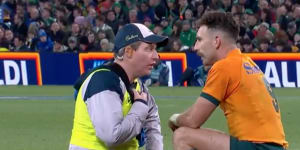 Nic White with Wallabies physio Keiran Cleary during Australia’s Test against Ireland.